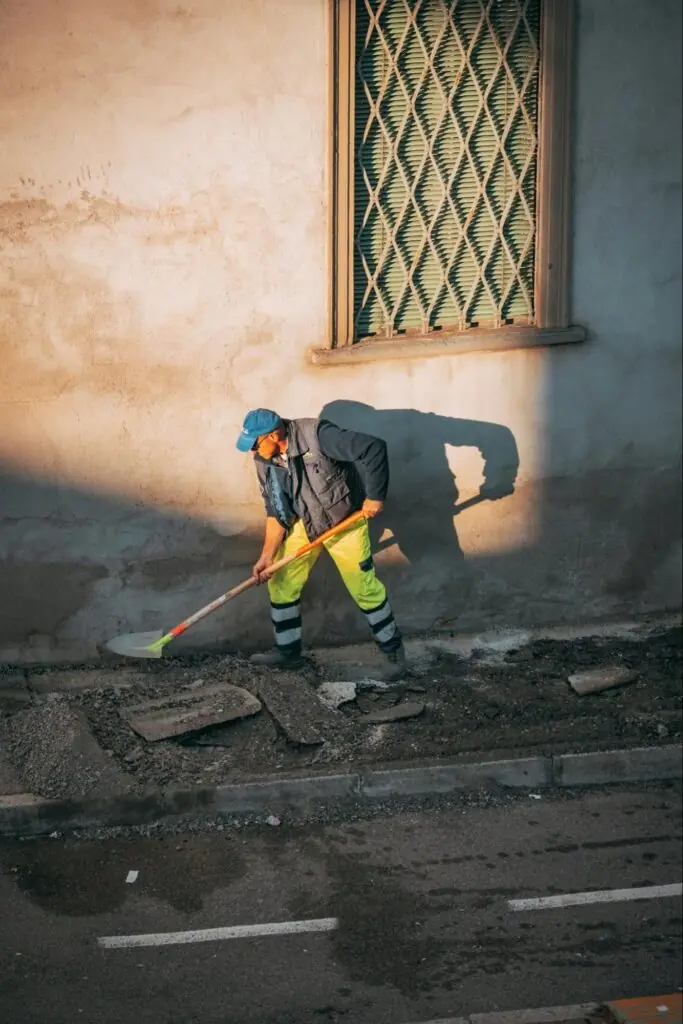 stucco contractor cleaning the sides of a stucco home